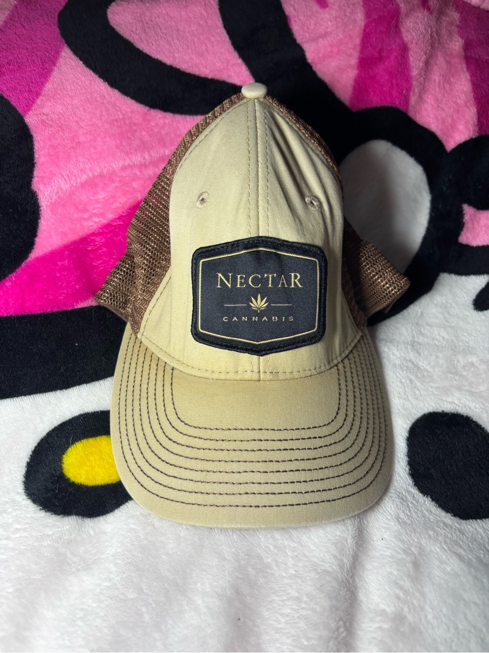Unisex Nectar Cannabis brand trucker hat.